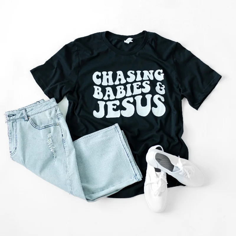 Chasing Babies and Jesus Graphic Tee in Black